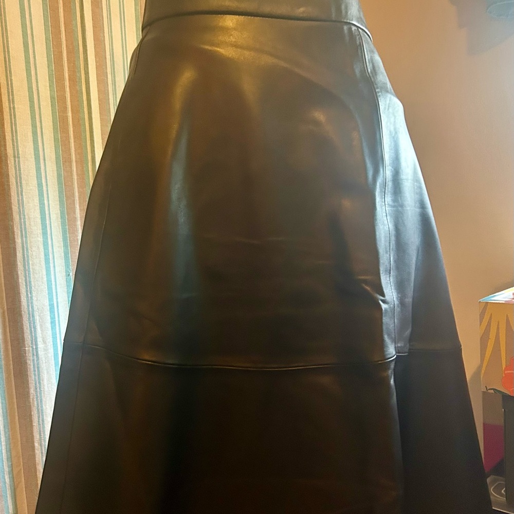 Artisan made black leather A line midi skirt made of lamb leather.